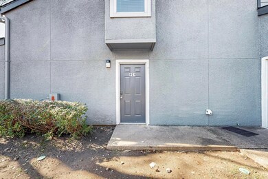 Doorway to property featuring stucco siding