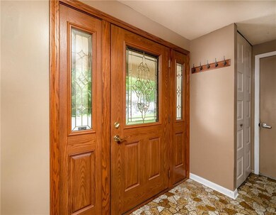 Beautiful entry way front door with glass inlay an
