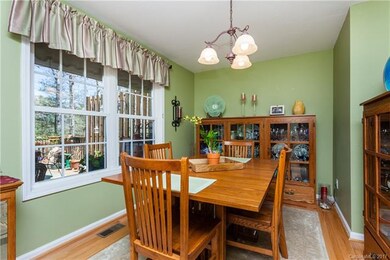 Dining room with view onto private deck.