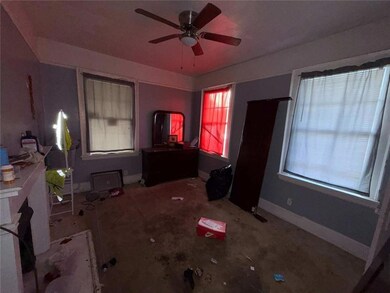 Bedroom with baseboards