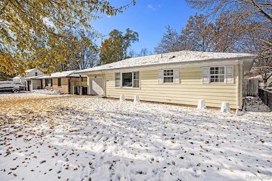 Single story home featuring a garage