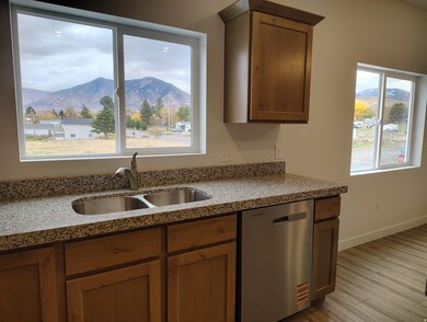 Windows over the kitchen sink and dining area provide nice natural lighting.