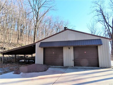 Photo shows North entrance thru extra high garage 