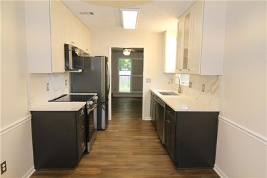 Kitchen with a sink, stainless steel appliances, w
