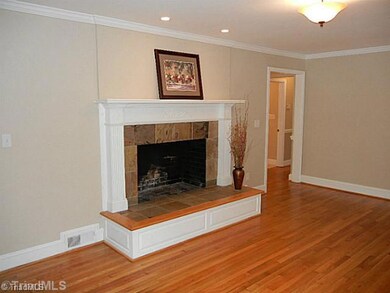 Living Room. Gleaming hardwoods, crown molding, canned and overhead lighting in this spacious living room.