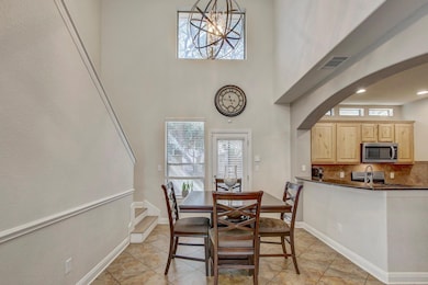 Dining area featuring visible vents, baseboards, 