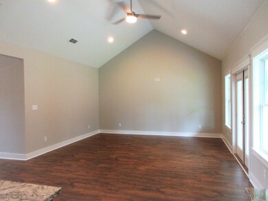 Vaulted Ceilings with a pair of French Doors leadi
