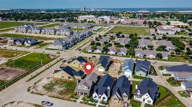 Aerial overview of property's location featuring nearby suburban area