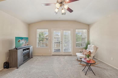 Living area with lofted ceiling, healthy amount o