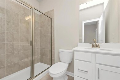 Full bath with vanity and a stall shower