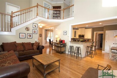 Open stairway leading to master bedroom suite and 
