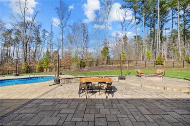 Backyard swimming pool, hot tub, hardscaping, fire pit, dining space, screened porch!