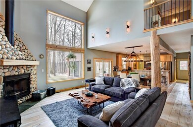 The home has been professionally painted in the latest, sleek neutral tones.  There is an upper level landing with an exposed wrought iron catwalk.