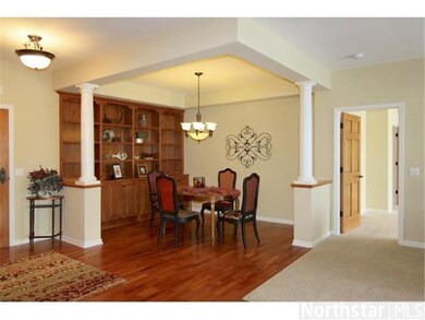 Formal dining room is anchored by built-in cherry 
