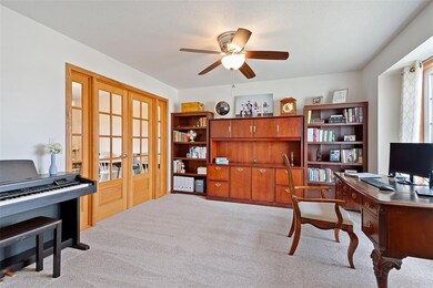 Main floor office; behind center cabinet is wired 