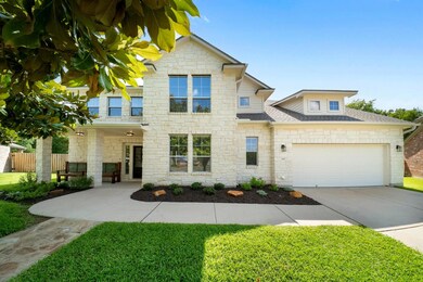 View of front of house with stone siding, an atta