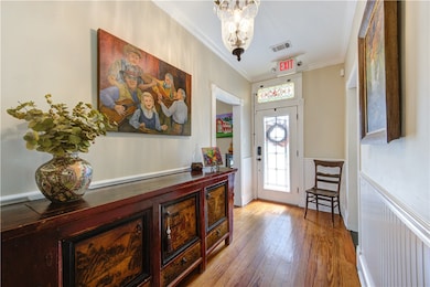 Entryway with ornamental molding, hardwood / wood-