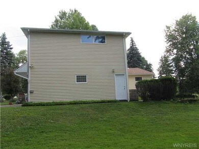 Exterior Back. Separate side entrance to garage ap