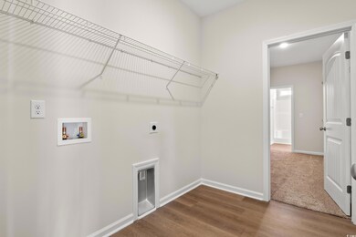 Laundry area with washer hookup, hookup for an ele