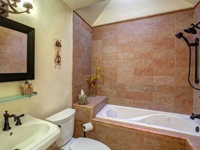 Hall bath with jetted spa tub