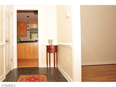 Foyer - Foyer has slate floor, chair rail, and coa