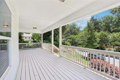 Porch featuring view of scattered trees
