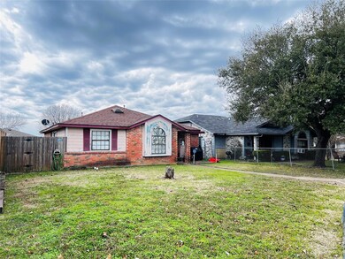 Single story home with a front lawn