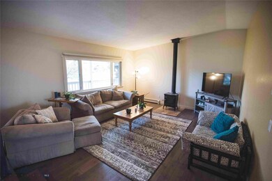 Main floor living room with porcelain stove