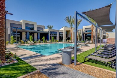 Community pool with a patio