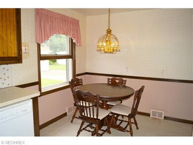 This is the only wall paper to remove throughout the space. Update the fixture and window treatments and you've got a great eat-in kitchen.