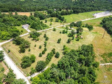 Aerial view of sparsely populated area with a heavily wooded area