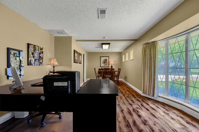 Large Office featuring, hardwood / wood-style floors, and plenty of natural light