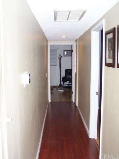 HALLWAY TO 2ND BEDROOM & MASTER BEDROOM WITH WOOD 