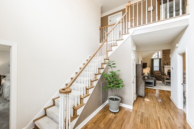 As you enter the grand foyer you are greeted by staircase, wood flooring and freshly painted wall!