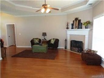 The pretty corner fireplace is the focal point of 