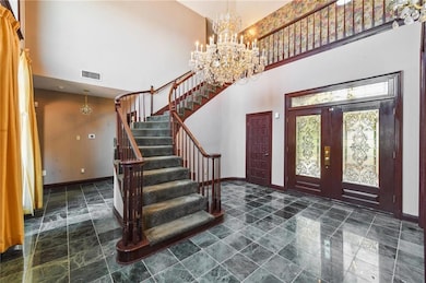 Grand Foyer with views of the lake and a brilliant