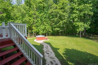 Stone pathway leading from refinished deck to hot 
