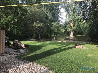 Sloping yard to the creek.  Water is up due to the