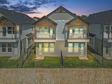 Rear view of property featuring a fenced backyard,