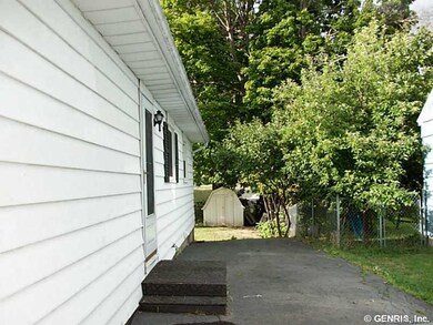 Exterior Front. Side door with entry to the kitche