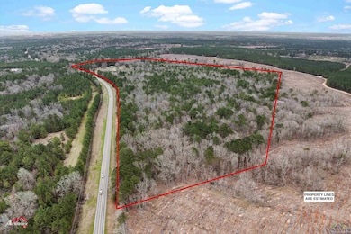 Birds eye view of property featuring a view of tre