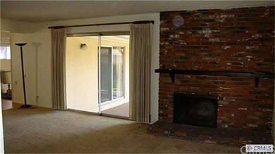 Huge living living room has a warm and inviting fi