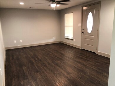 Spacious Living Room with New Wood Floors
