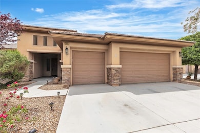 Prairie-style home with stucco siding, stone sidin