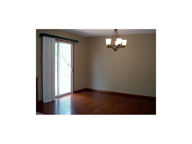 New hardwood floors gives this large dining room g