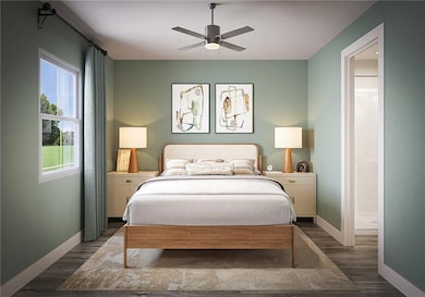 Bedroom featuring connected bathroom, baseboards, ceiling fan, and dark wood finished floors