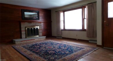 Large front picture window, wood burning fire plac