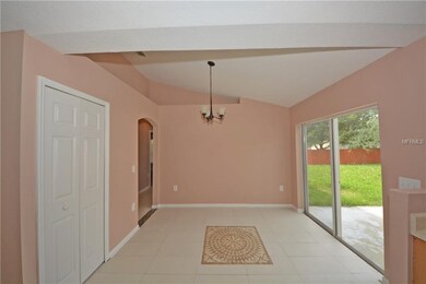 The dining room has a sloped ceiling and a double 