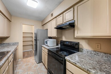Cozy galley kitchen with plenty of countertops, am