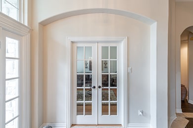 French Doors lead to Living Room